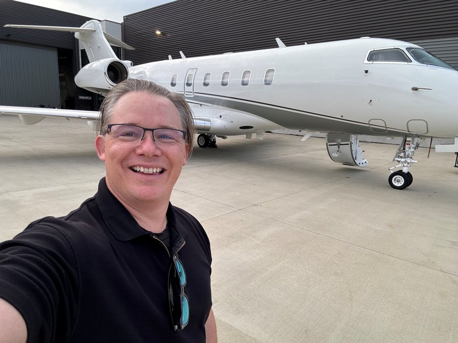 Team member with a Challenger 350 business jet